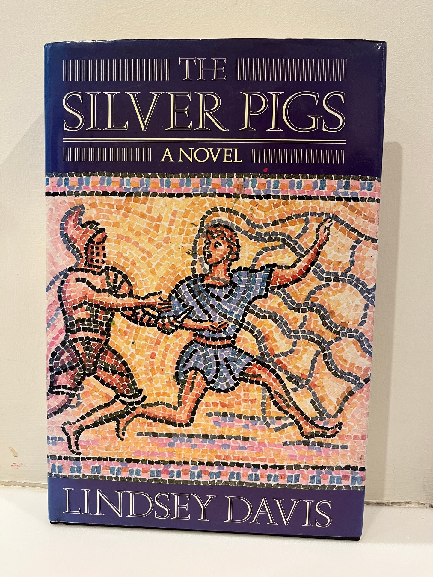 The Silver Pigs by Lindsey Davis Hardcover/Dust Jacket, 1st UK Edition/1st Printing