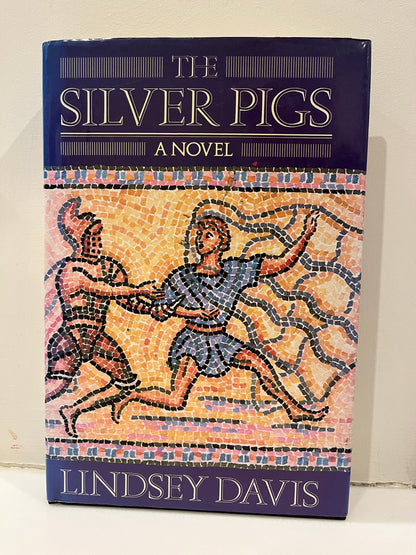 The Silver Pigs by Lindsey Davis Hardcover/Dust Jacket, 1st UK Edition/1st Printing